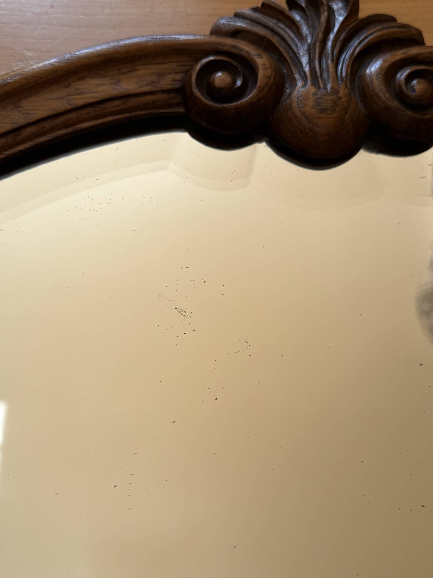 Antique bevelled mirror, oak frame