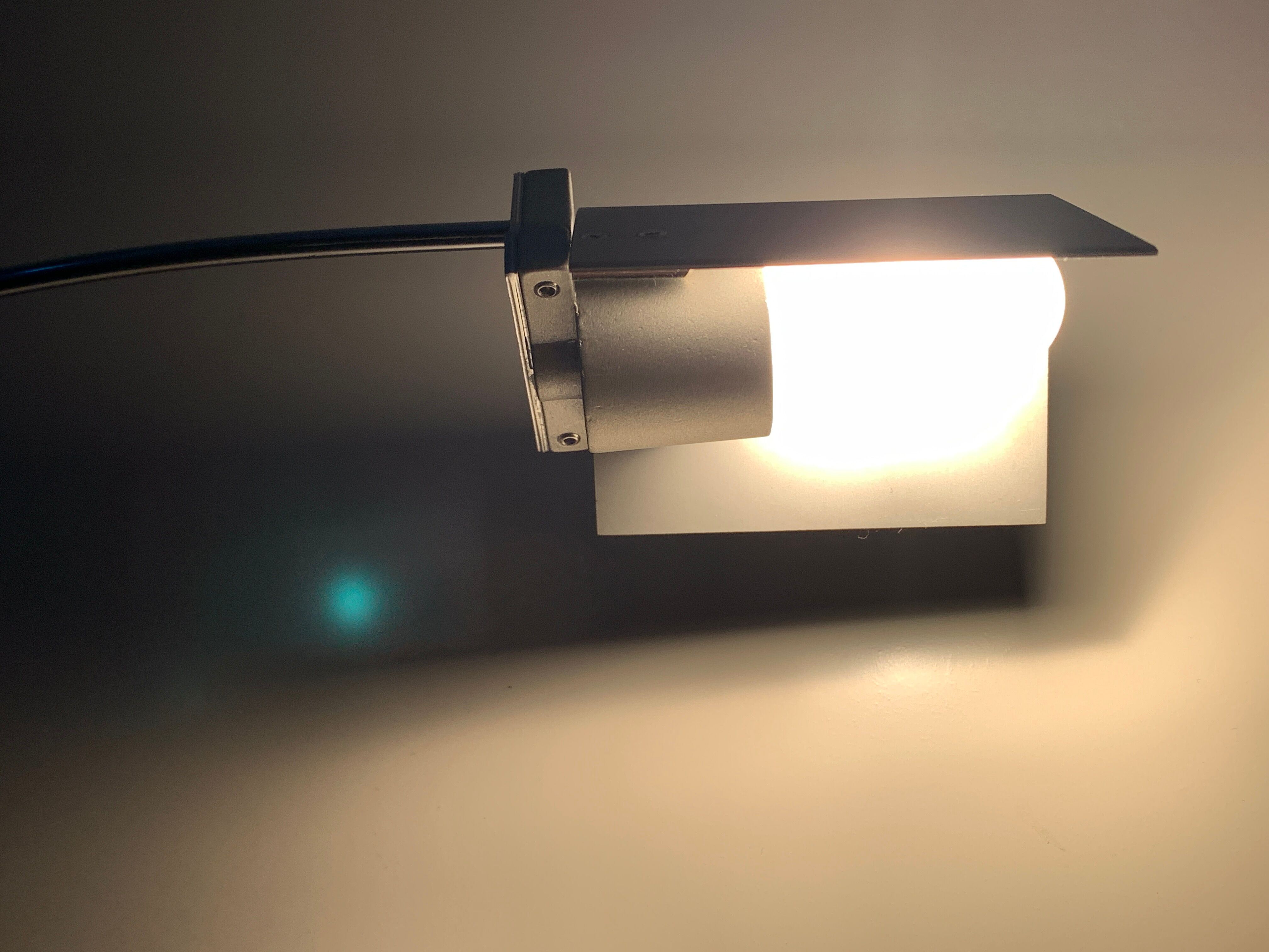 Chromed metal and glass floor lamp designed by Fontana Arte, Falena model by Alvaro Siza, 1990
