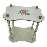 Shelf coils monogrammed patinated wood