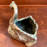 Empty pocket - bronze swan