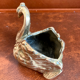 Empty pocket - bronze swan