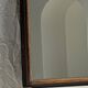 Small antique English rectangular mirror with pediment and oak frame