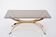 Gold Colored Mid-Century Modern coffee table with smoked Glass top