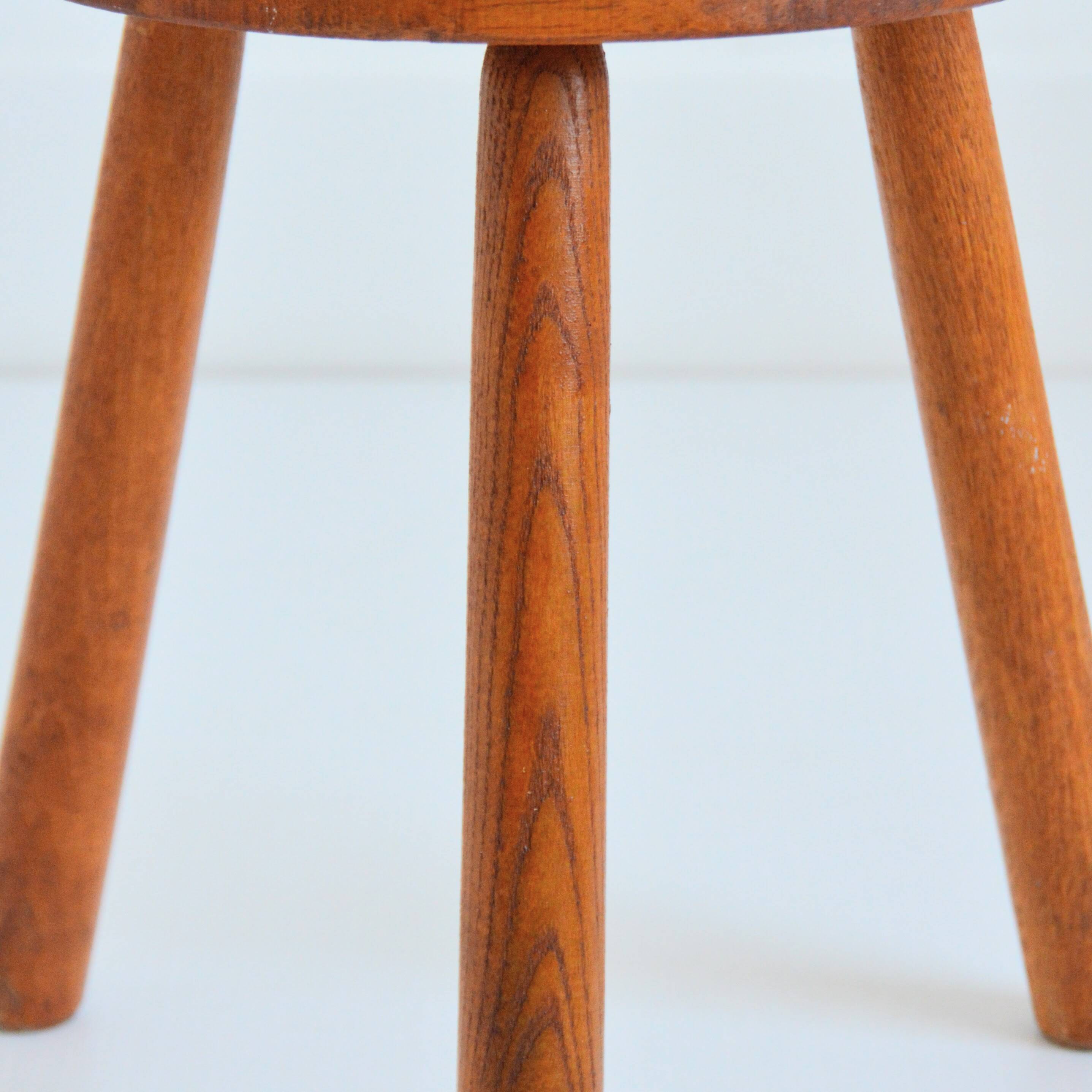 Antique brutalist wooden stool