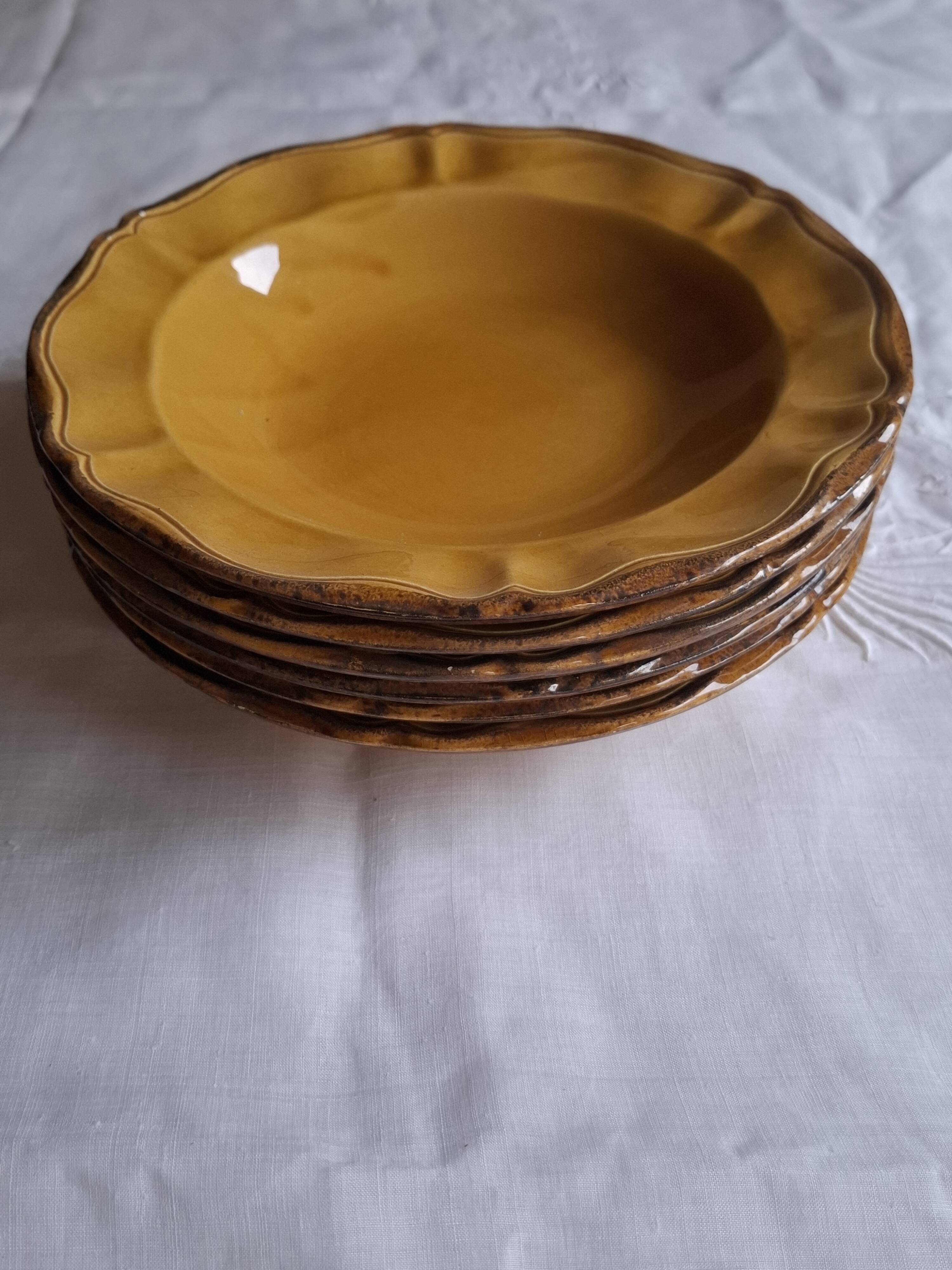 6 ochre deep plates from the Faïencerie de Haute Provence.