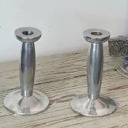 Pair of minimalist polished aluminium candle holders