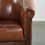 Vintage sheepskin club armchair in English style with deep colours