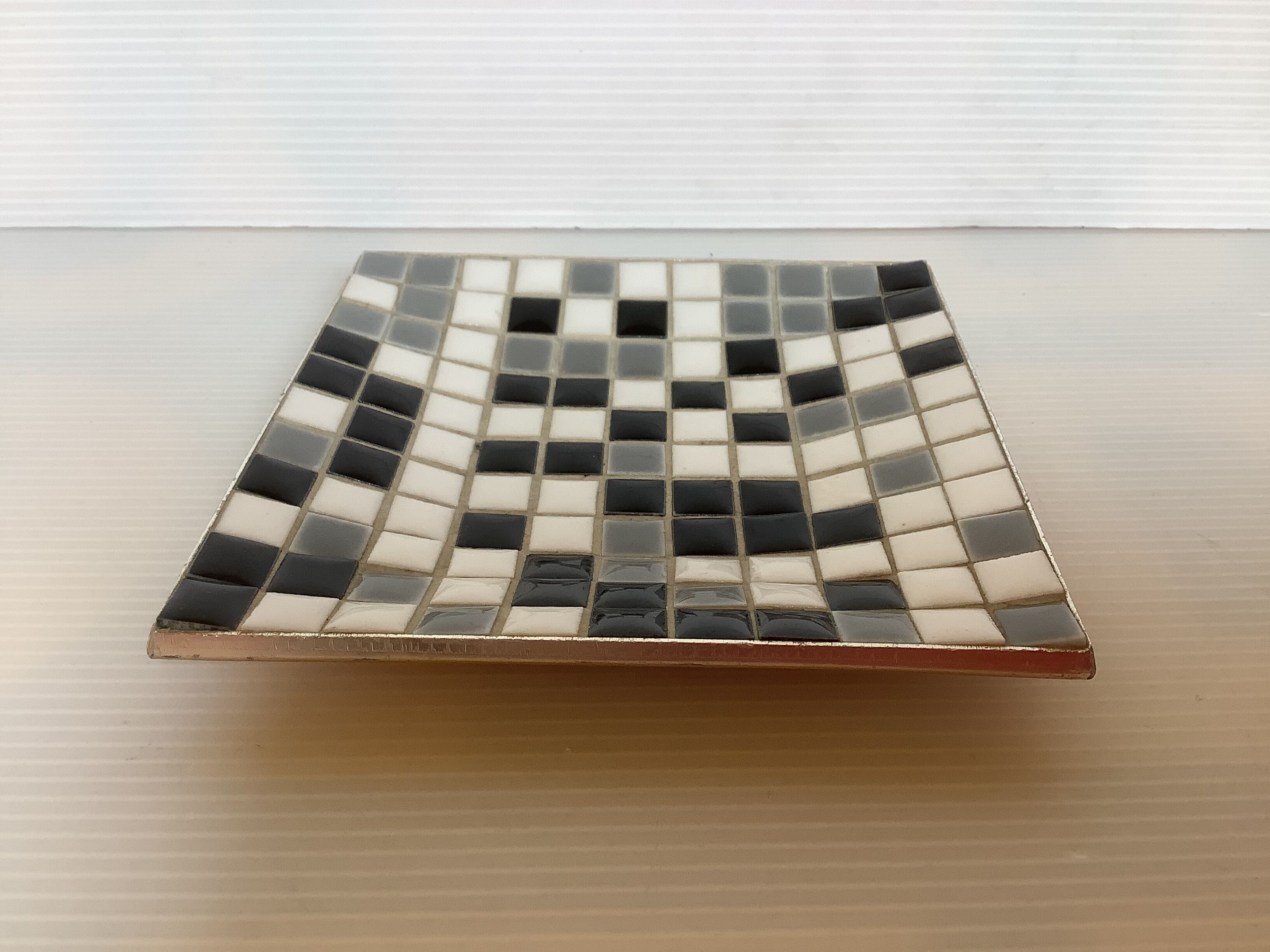Mosaic grey, white, and black catch-all tray.