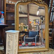 Large carved and gilded wooden mirror in Louis XV style