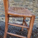Antique straw chair with low back