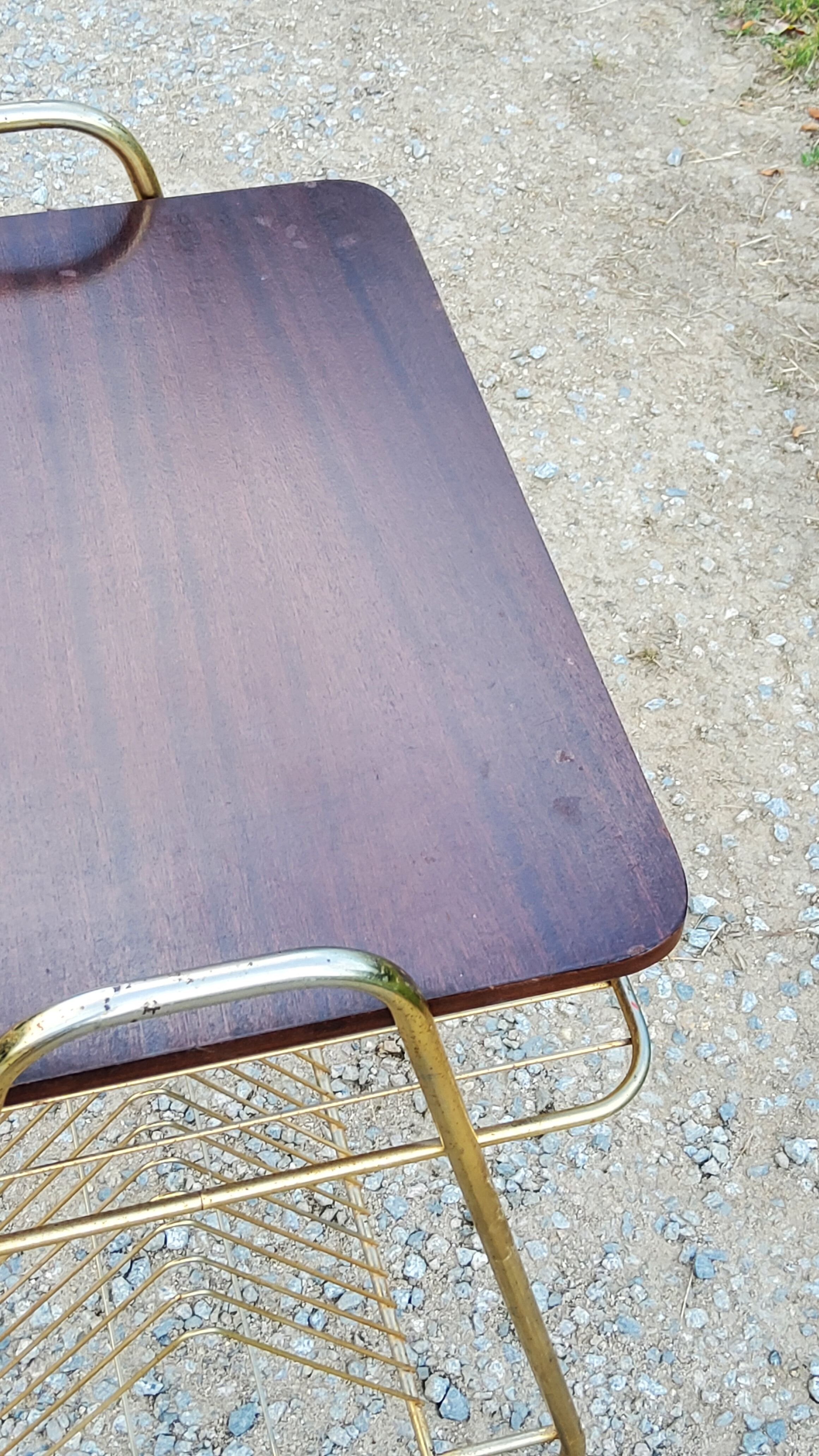 Side table of the 60s mahogany and gold metal range discs