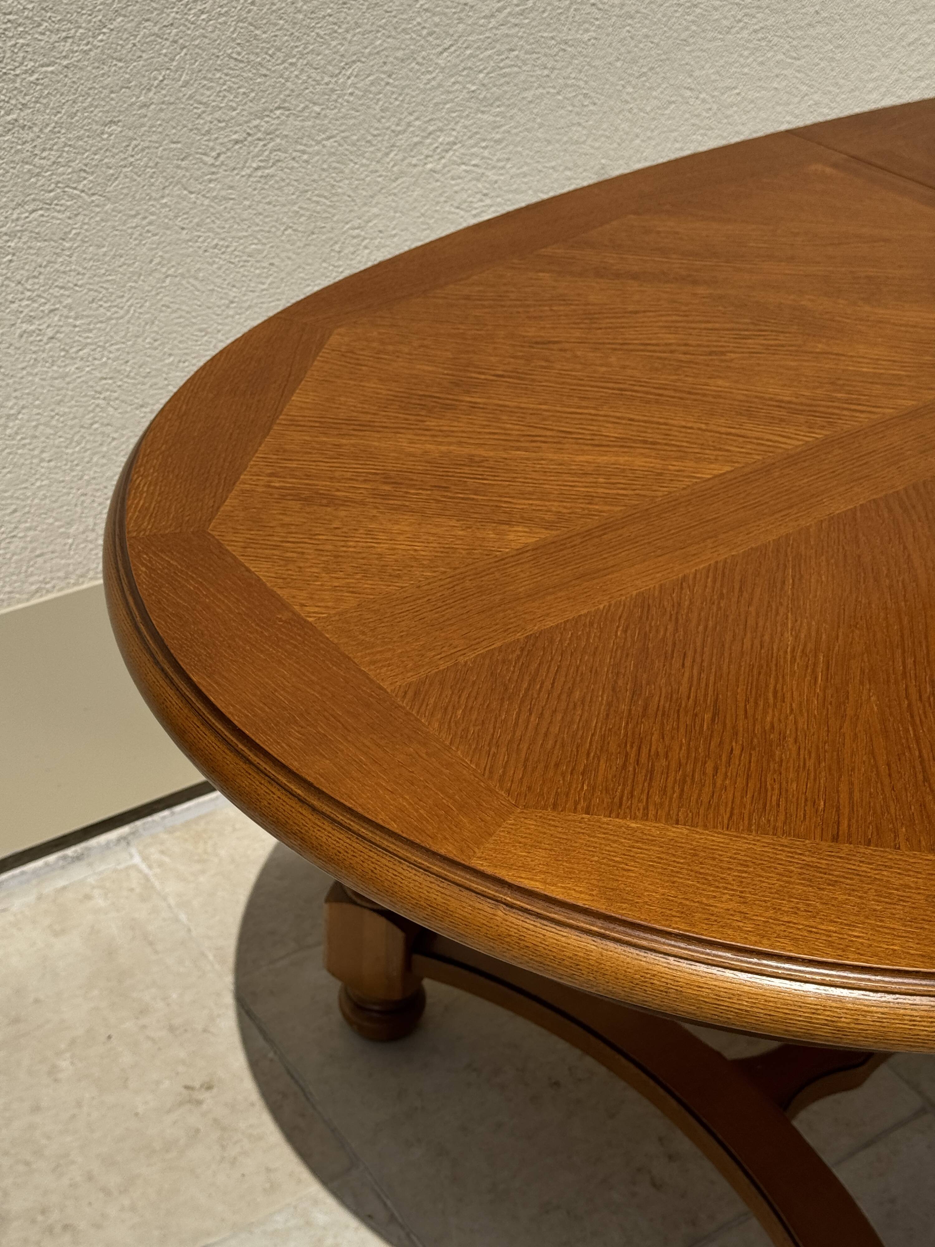 Oak dining table, oval living room table with two extensions.