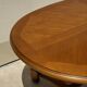 Oak dining table, oval living room table with two extensions.