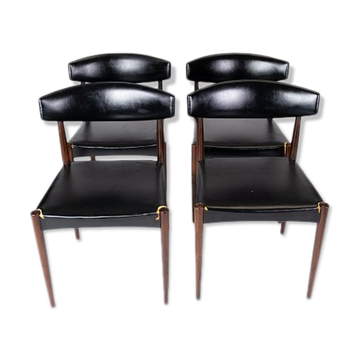 Set of four dining room chairs in rosewood and black leather of danish design from the 1960s.