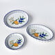 Set of 3 vintage ceramic dishes with wicker baskets.