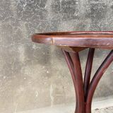 Pedestal table in curved wood