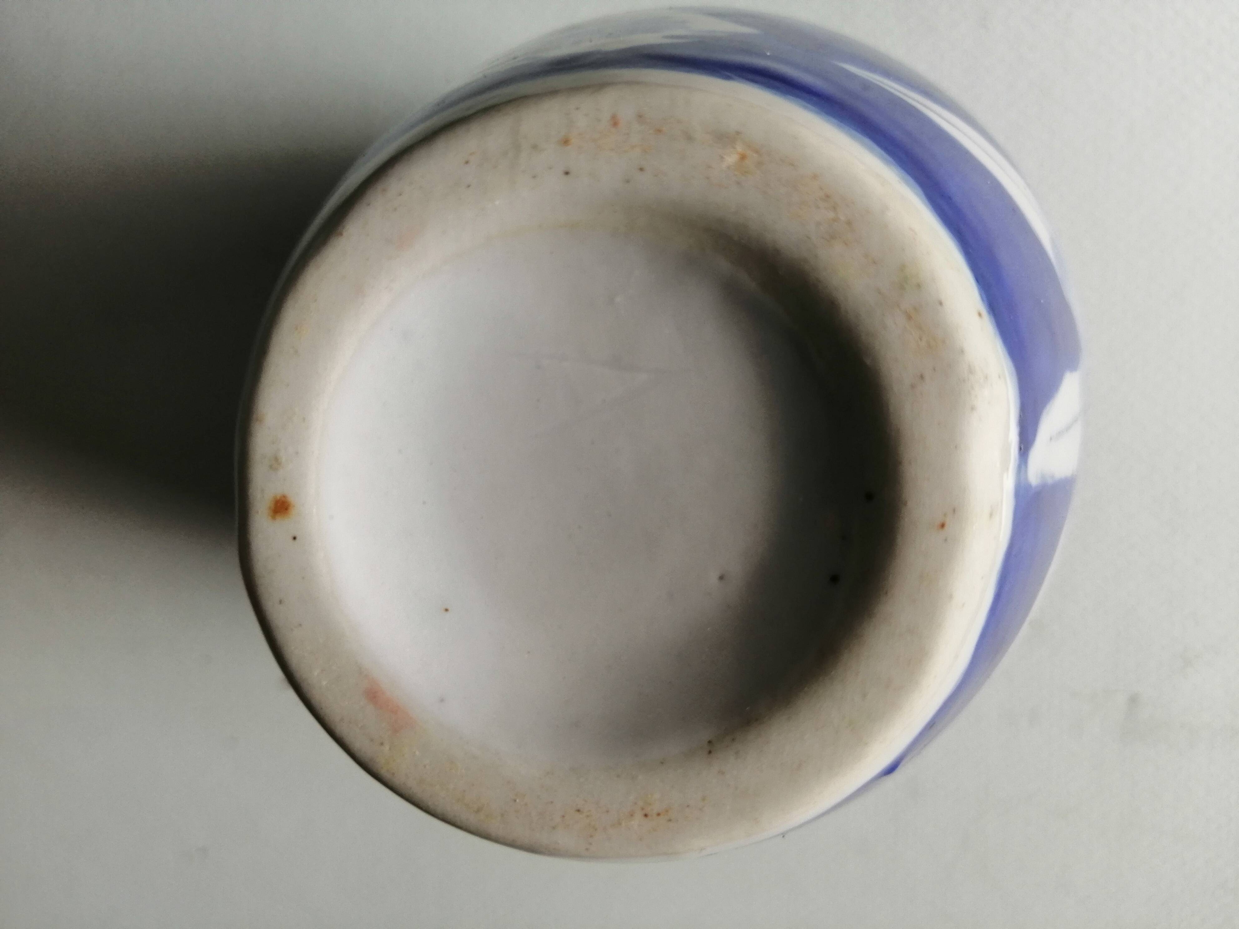 old vase in white and blue ceramics