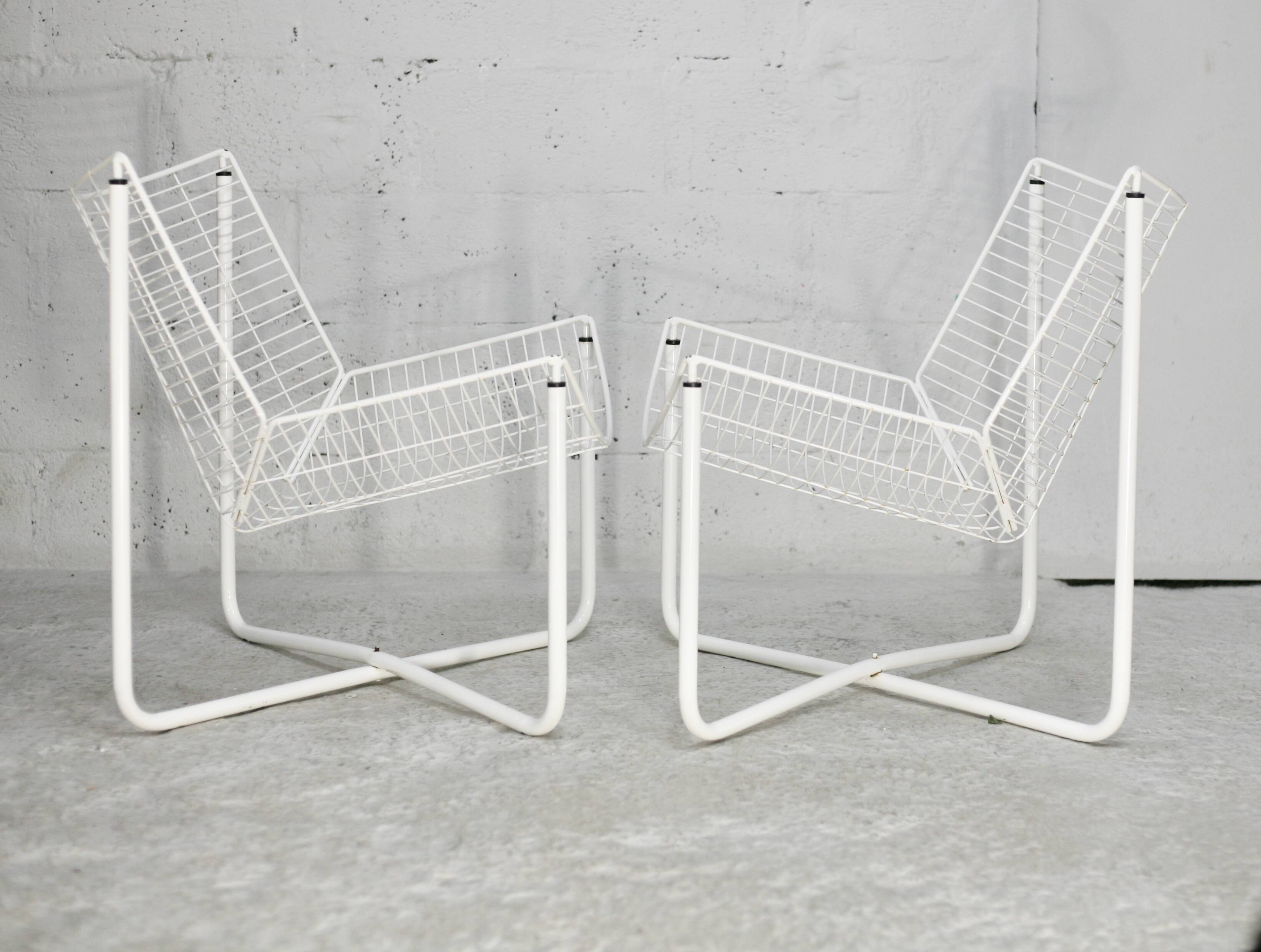 Pair of white lacquered steel rod armchairs. Circa 1985