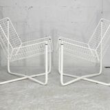 Paire de fauteuils tiges d'acier laqués blanc. Circa 1985