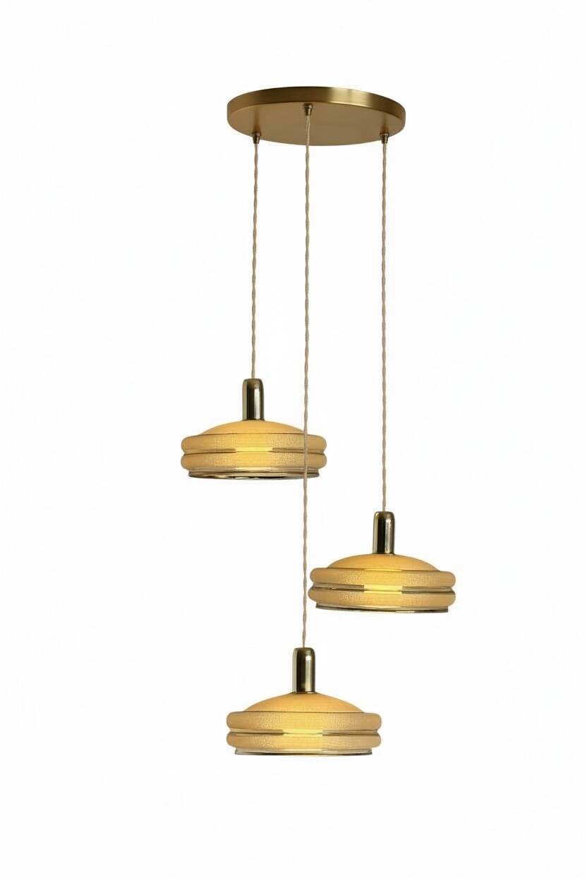 Triple cascade pendant light with vintage frosted glass globes and gold finish