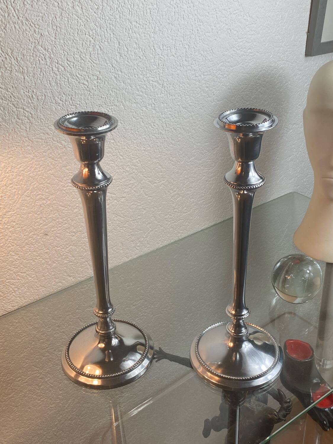 Pair of silver-plated metal candlesticks