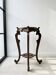 Meuble de rangement classique en bois sculpté marron
