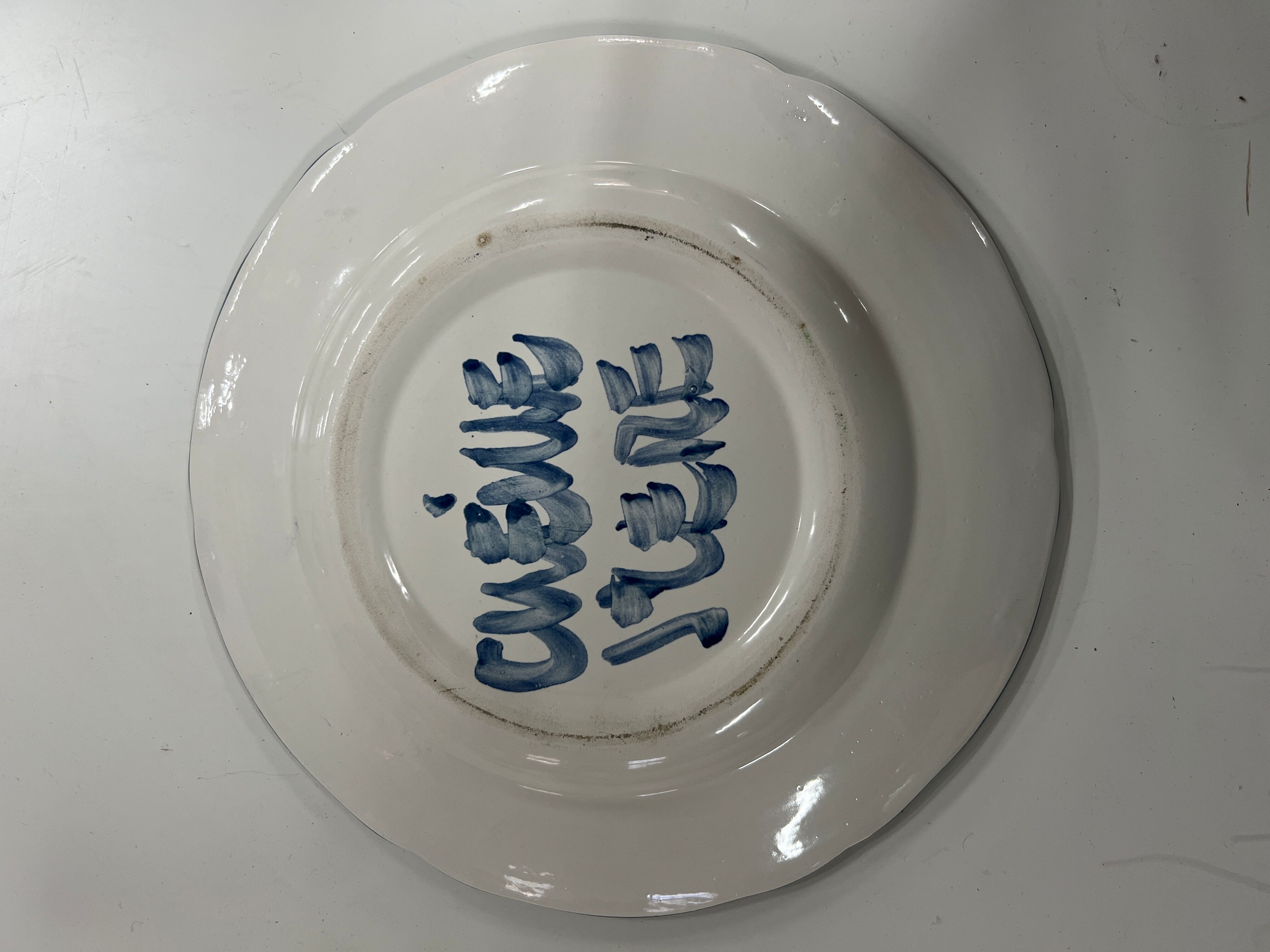 Painted and enamelled ceramic plate