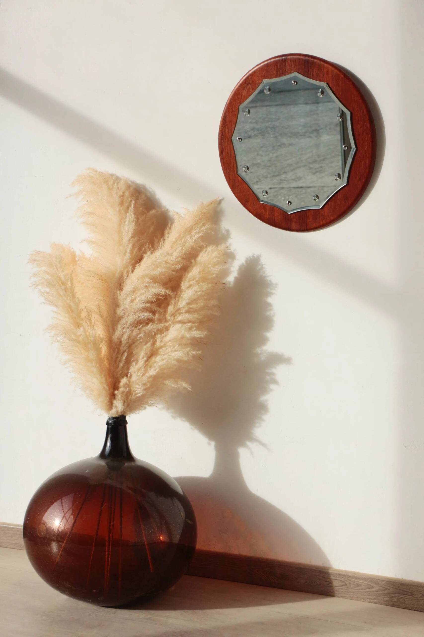 Vintage round teak mirror from the 1960s.