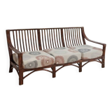 Salon vintage Maison Maugrion en rotin et finitions cuir et plume