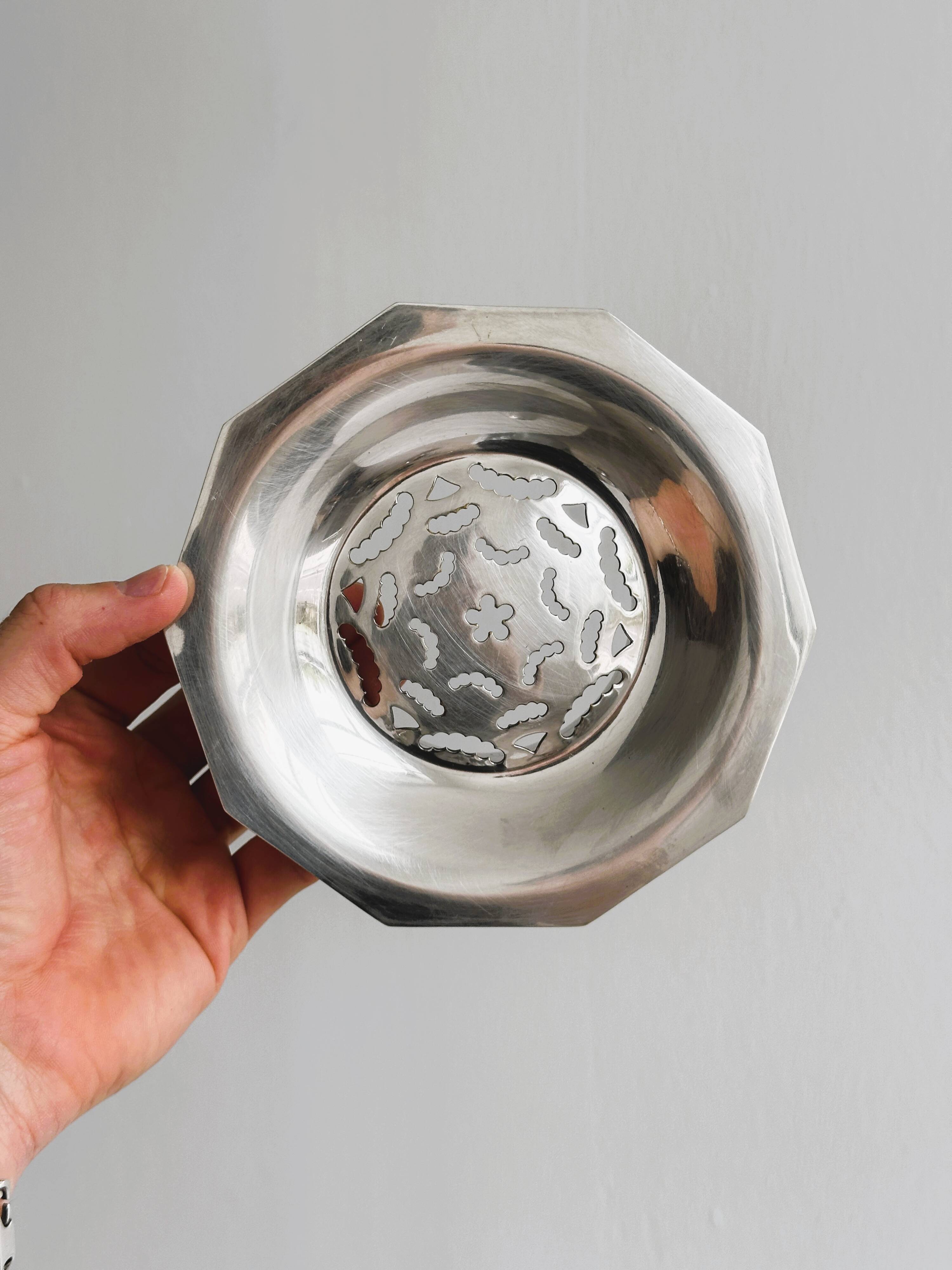 Antique butter dish in shiny metal