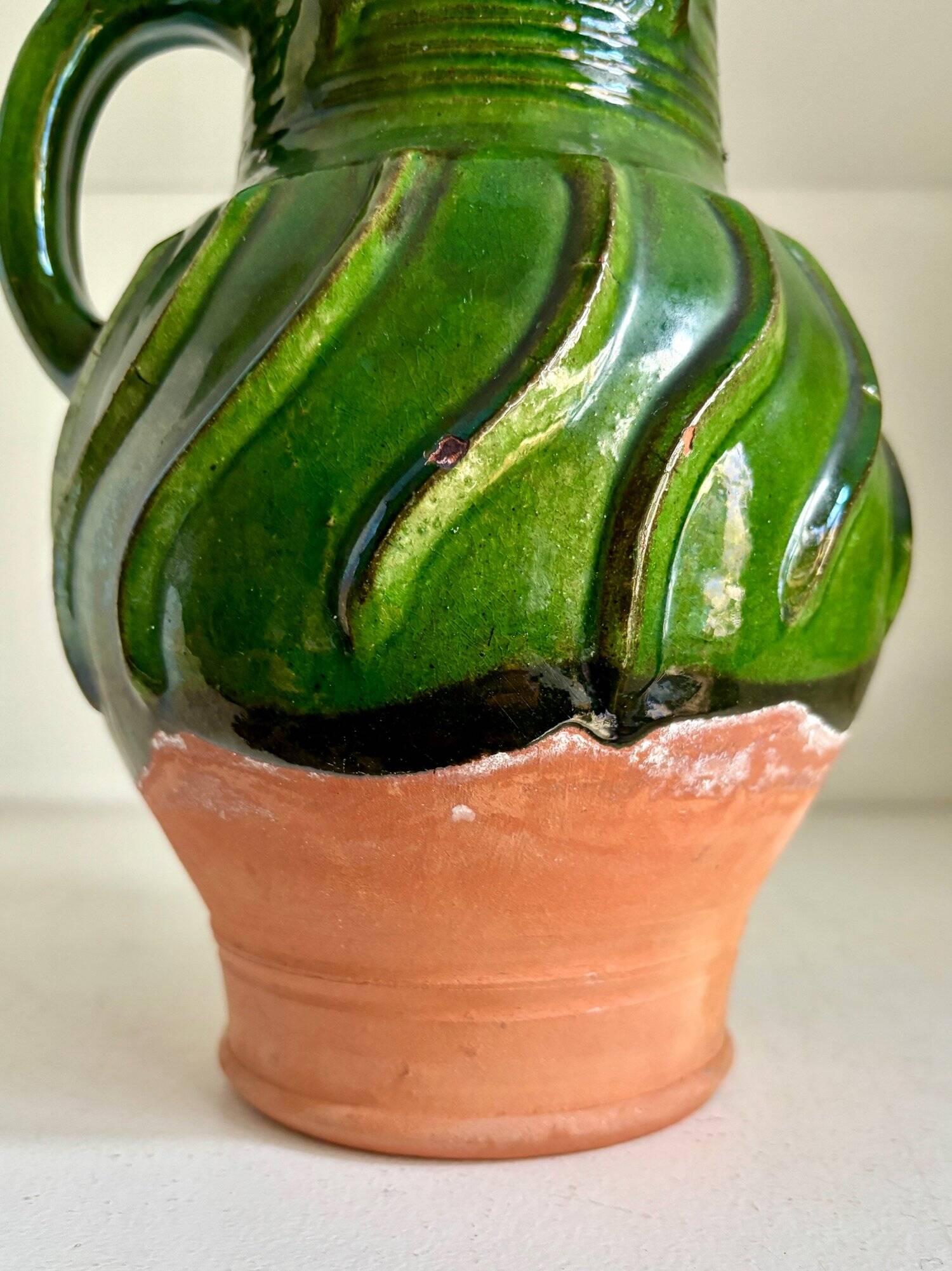 Green glazed terracotta pitcher