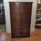 Old double curtained oak filing cabinet
