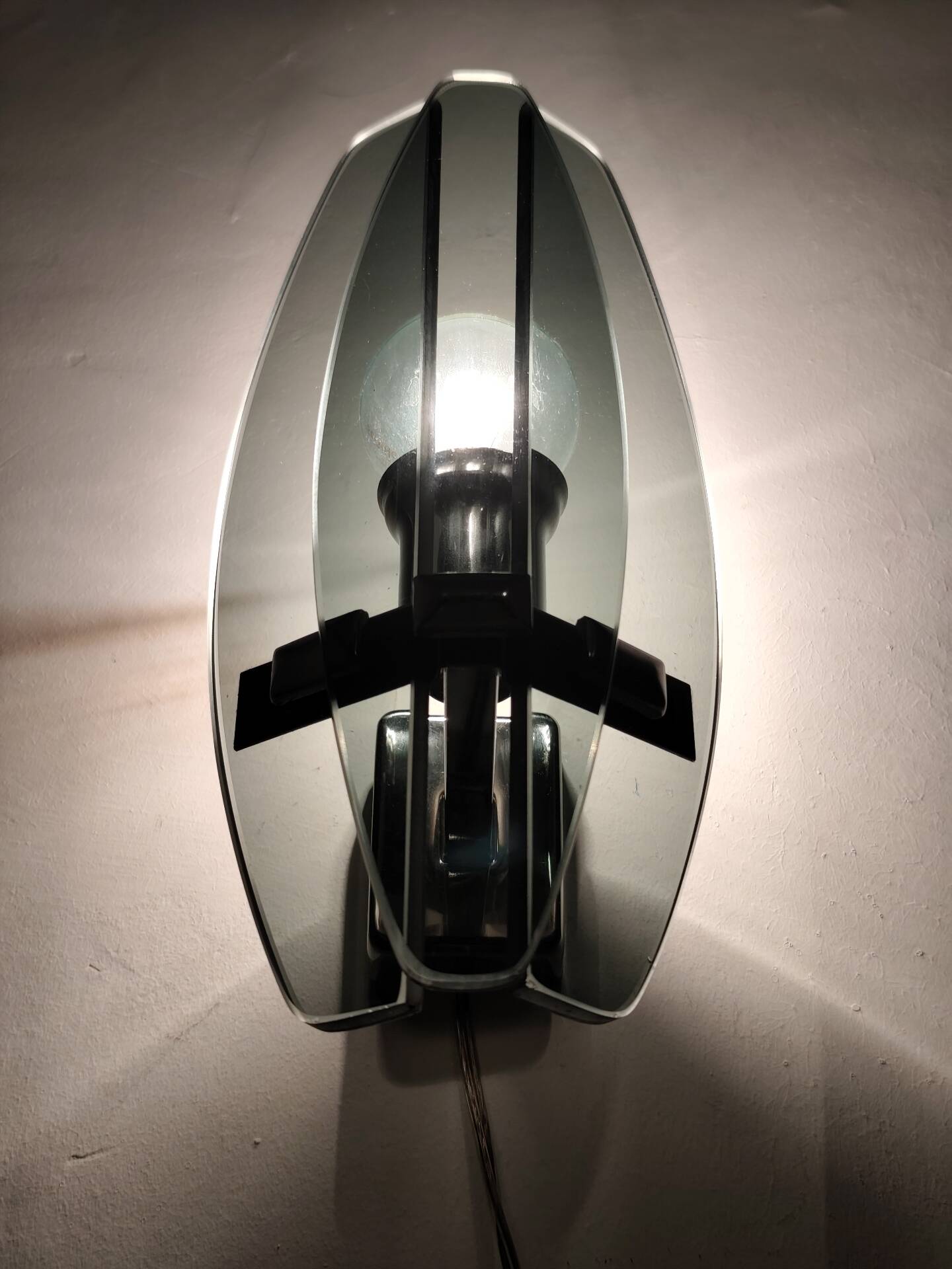 Smoked glass wall sconce. Italy, 1970s.