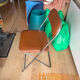 Brown folding chair in vinyl and steel