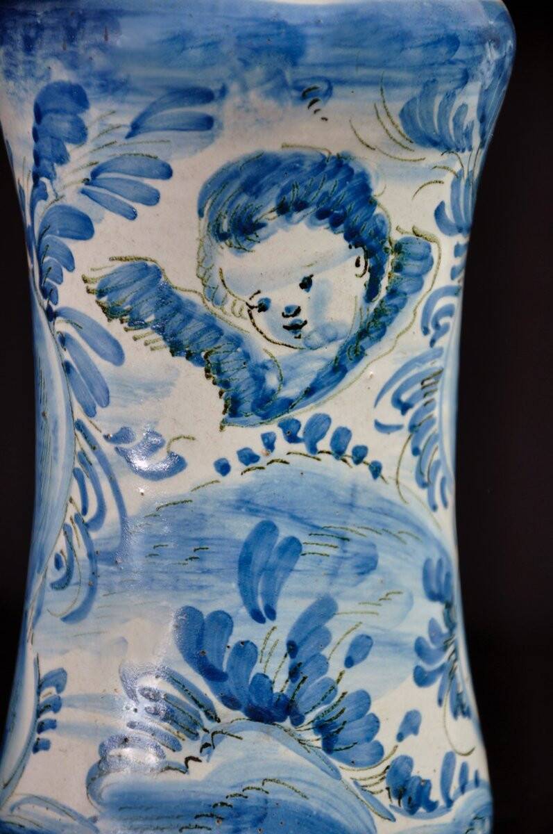 Albarelo in earthenware decorated in blue monochrome with a cherub motif, late 17th century