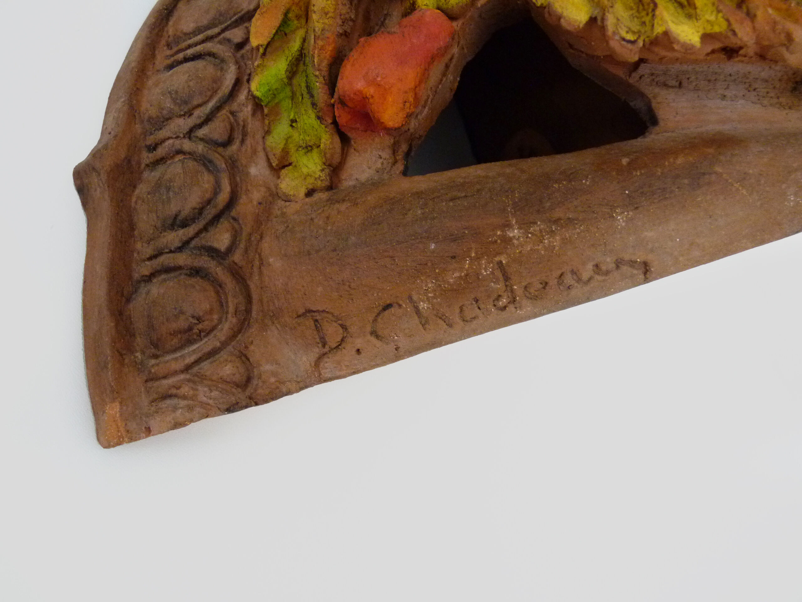 Corner wall lamp in terracotta with fruit decoration, signed D.Chadeau