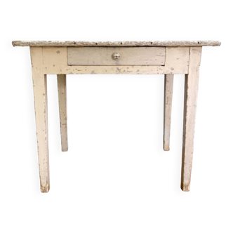 Old wooden farm table with white patina
