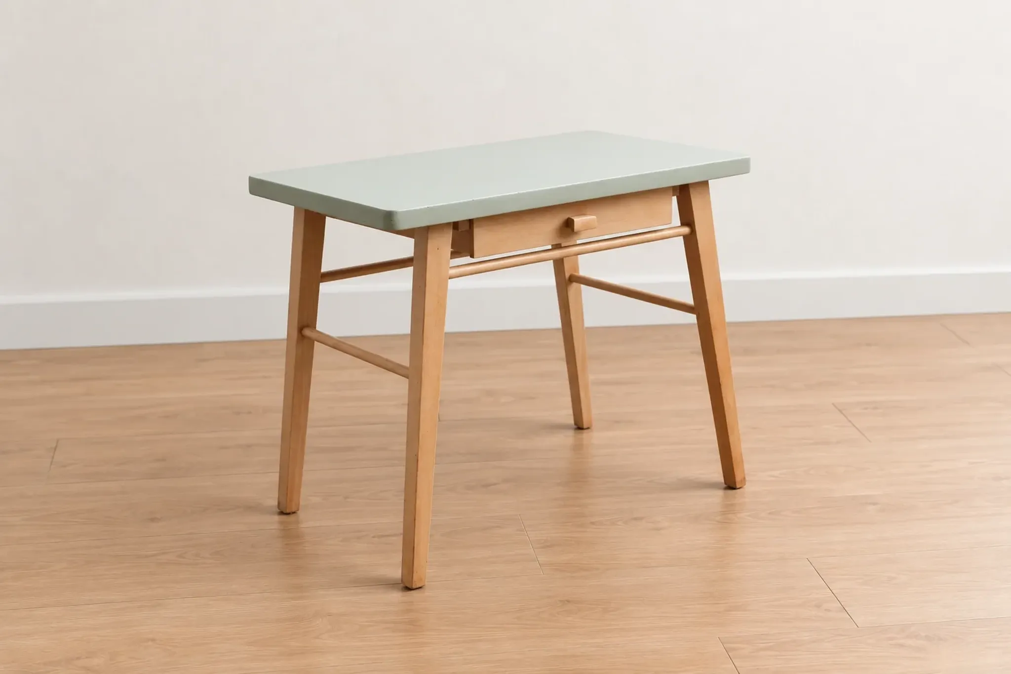 Small vintage children's desk attributed to Baumann – natural wood and lizard green top.