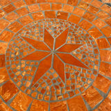Round garden table in mosaic and iron