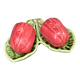 Ceramic salt shakers, slip in the shape of peppers.