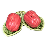 Ceramic salt shakers, slip in the shape of peppers.