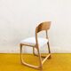 Baumann sled chair – golden oak & off-white fabric