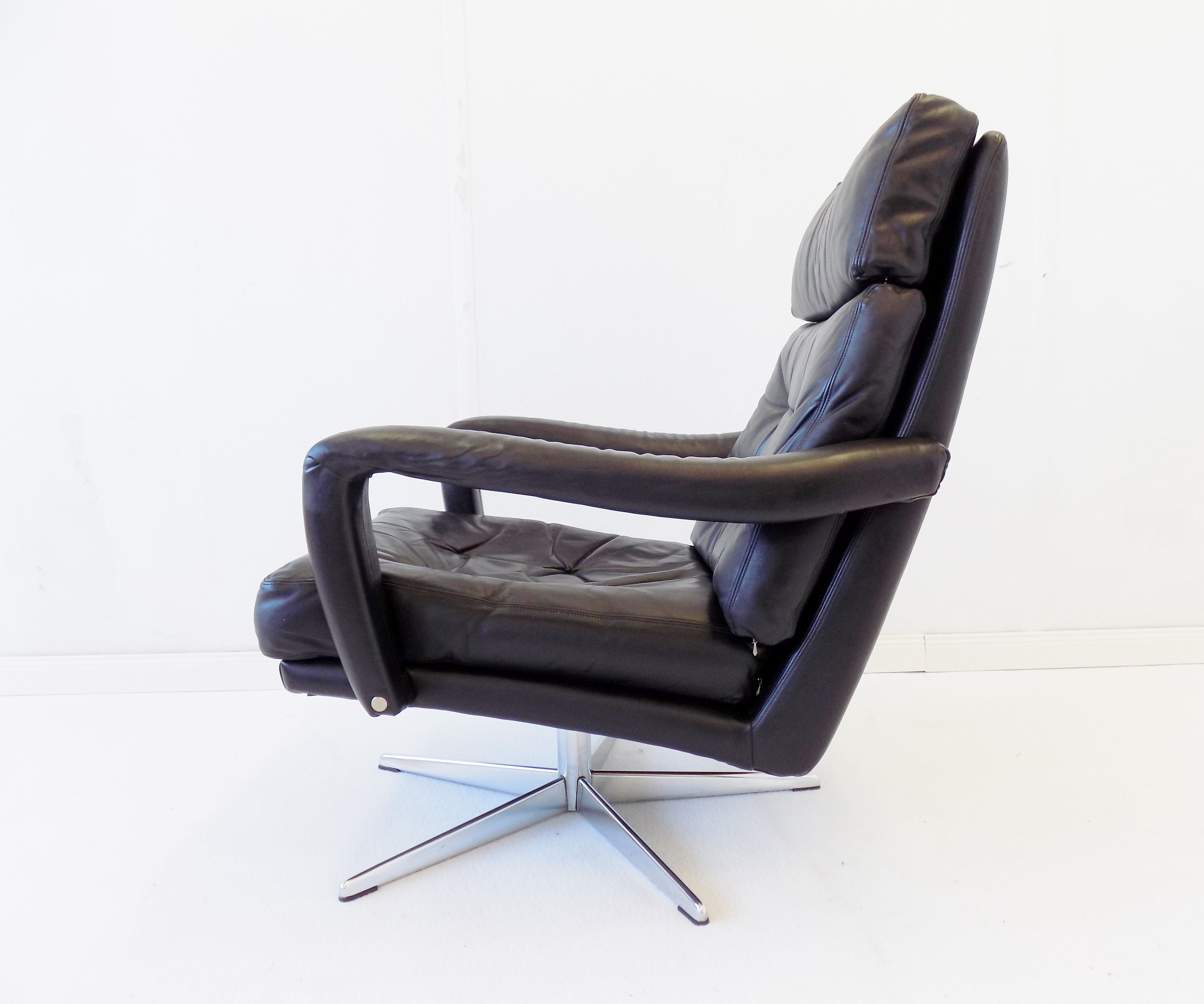 Danish black leather armchair with ottoman 70s