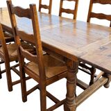 Large farmhouse table made of solid wood.