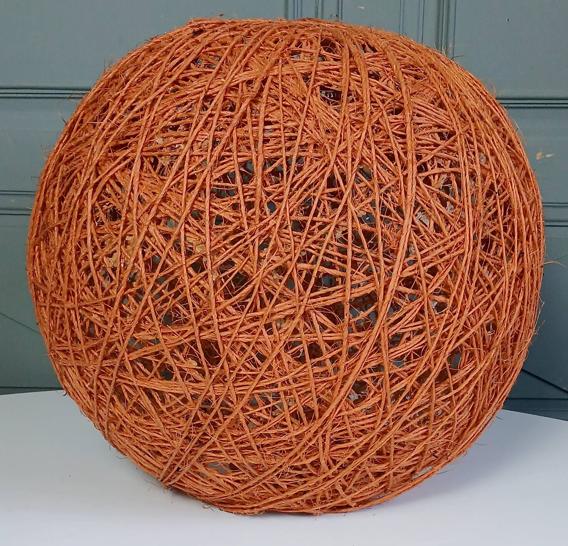 Orange lampshade in cord and rattan from the 1970s