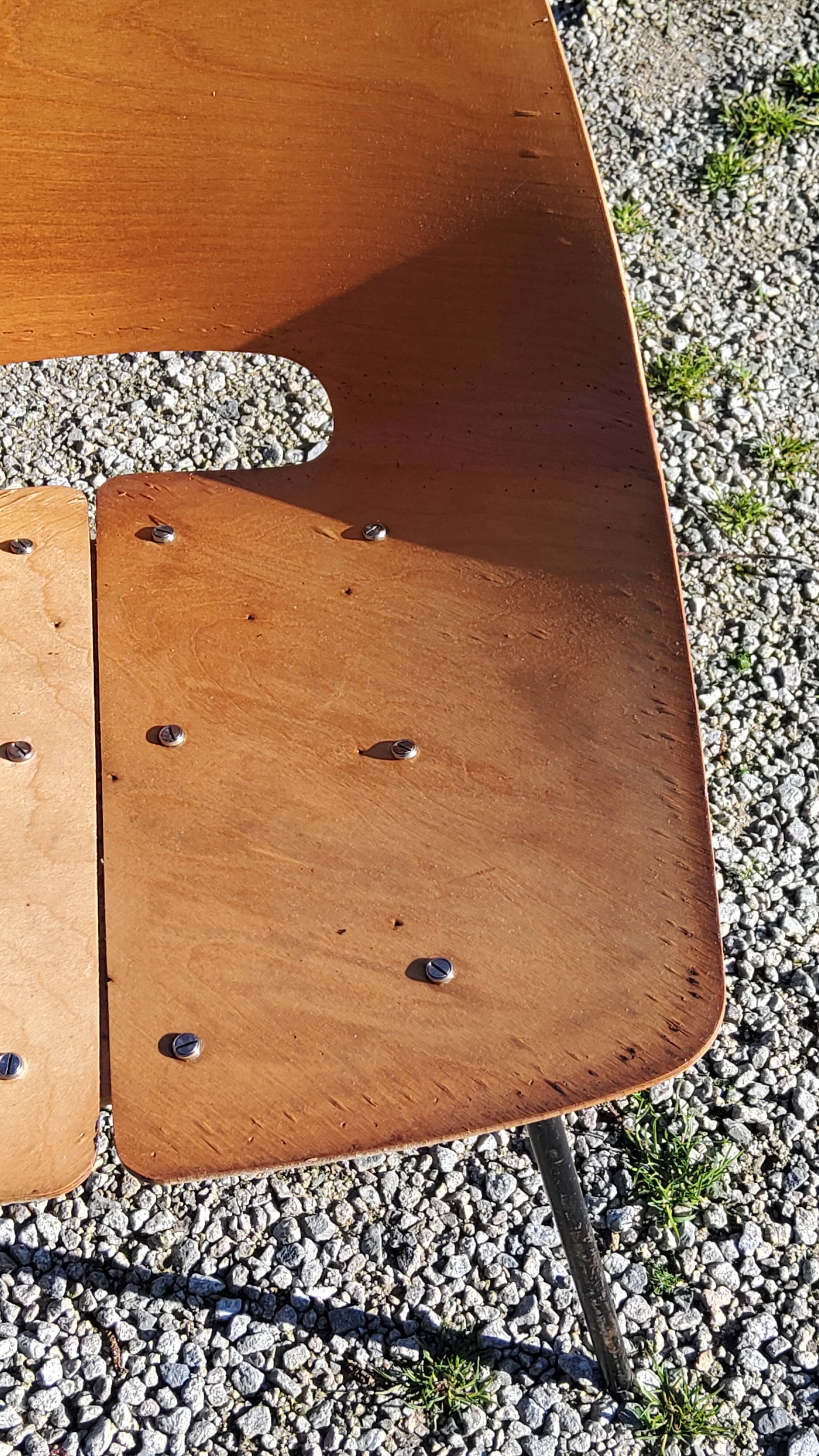 Pair of tonneau chairs by Pierre Guariche plywood base tubes 1954