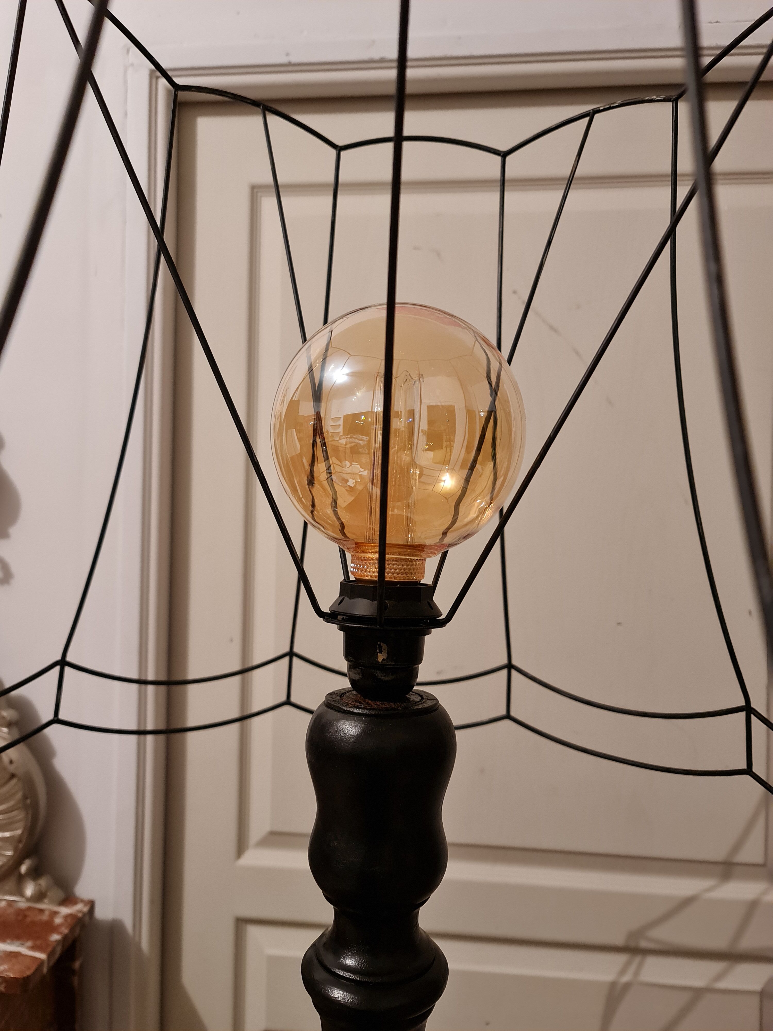 Matte black lamppost with small tablet