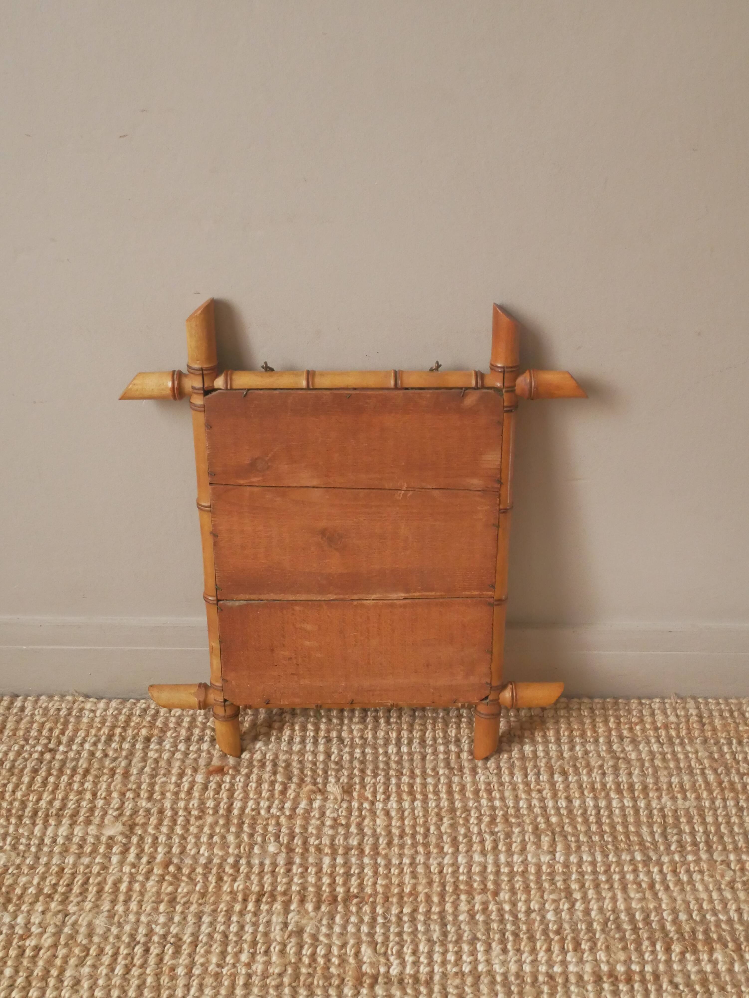 Vintage bamboo wooden mirror with retro bohemian spirit