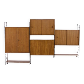 Modular wall shelf with boxes.