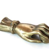Brass hand, paper press, 50s